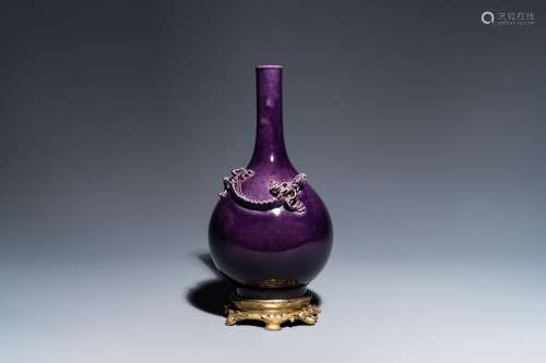 A Chinese monochrome aubergine-glazed bottle vase with gilt ...
