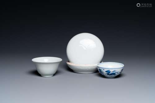 A Chinese white-glazed bowl, a small blue and white bowl and...