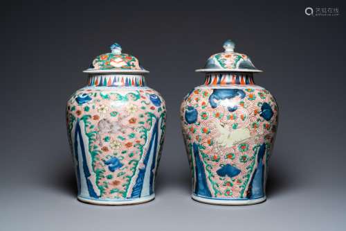 A pair of Chinese wucai 'galloping horses' vases and covers,...