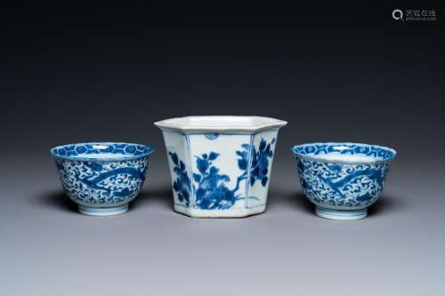 A Chinese hexagonal blue and white flower pot and two cups, ...