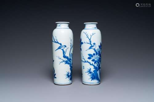 A pair of Chinese blue and white rouleau vases with birds am...