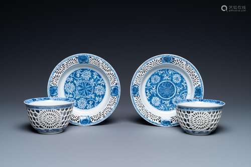 A pair of Chinese blue and white reticulated double-walled c...