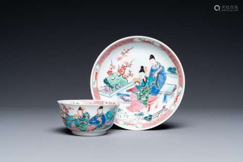 A Chinese famille rose cup and saucer with a couple on a ter...