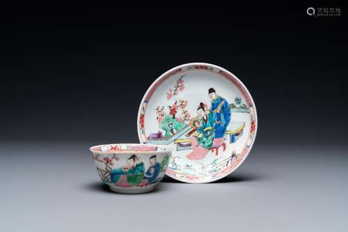 A Chinese famille rose cup and saucer with a couple on a ter...