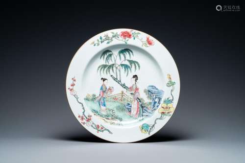 A large Chinese famille rose dish with ladies in a garden, Y...