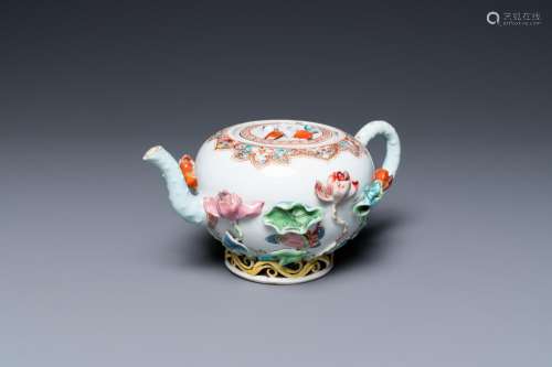 A Chinese famille rose teapot with applied floral design, Yo...
