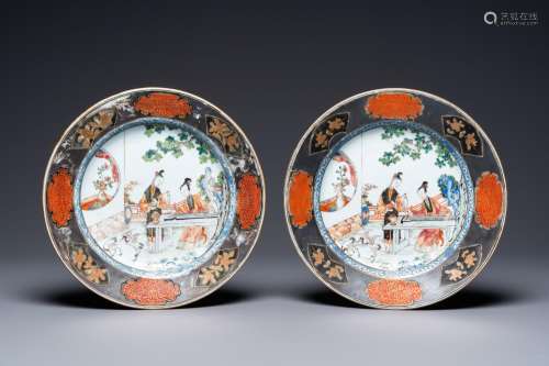 A pair of Chinese famille rose plates with ladies playing mu...