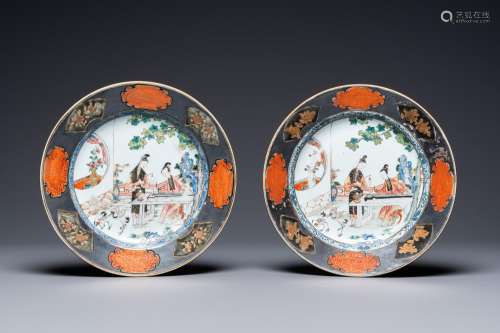 A pair of Chinese famille rose plates with ladies playing mu...