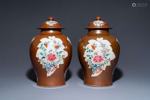 A pair of Chinese famille rose capucin brown-ground vases an...