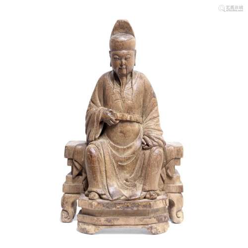 A WOOD CARVING OF A SEATED SCHOLAR 19th century