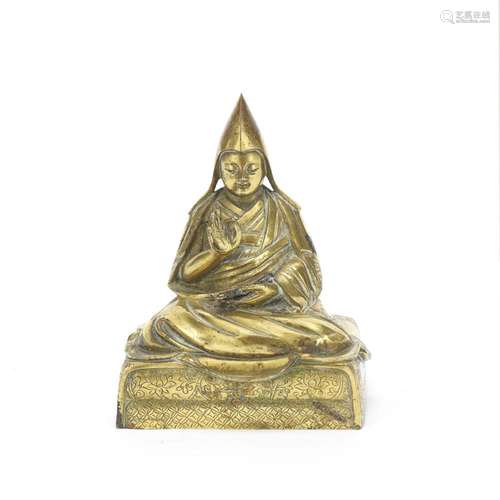 A GILT BRONZE SINO-TIBETAN FIGURE OF GELUKPA LAMA 19th centu...