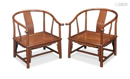 A PAIR OF HUANGHUALI HORSESHOE-BACK LOW ARMCHAIRS, QUANYI 20...