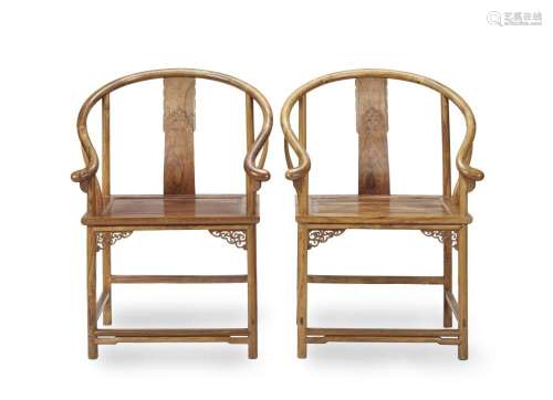 A PAIR OF HUANGHUALI HORSESHOE-BACK ARMCHAIRS, QUANYI 20th c...