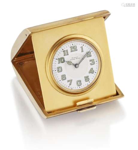 A SILVER-GILT FOLDING TRAVEL ALARM CLOCK. Circular white ena...