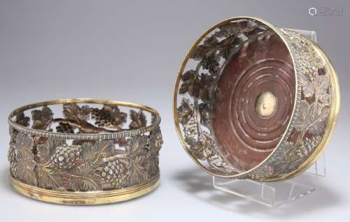 A PAIR OF GEORGE III SILVER-GILT LARGE WINE COASTERS