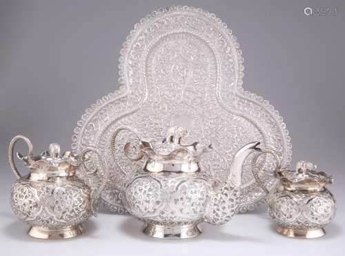 AN INDIAN SILVER THREE-PIECE TEA SERVICE AND TRAY