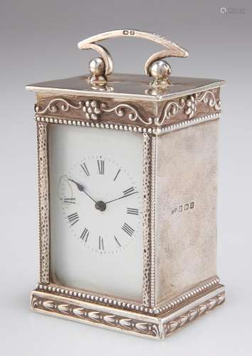 A GEORGE V SILVER TRAVELLING CLOCK