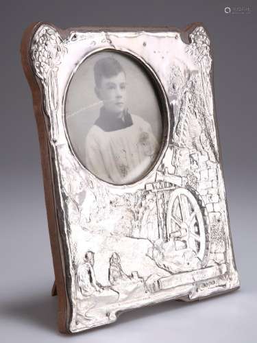 AN ARTS AND CRAFTS SILVER PHOTOGRAPH FRAME