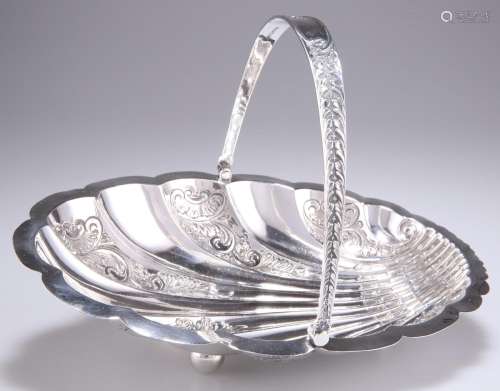 A VICTORIAN SILVER SWING-HANDLE CAKE BASKET