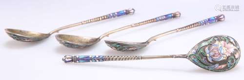 A SET OF FOUR RUSSIAN SILVER-GILT AND ENAMEL SPOONS