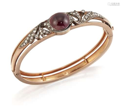 A GARNET AND DIAMOND BANGLE