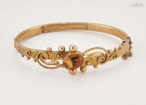 A VICTORIAN 9 CARAT GOLD CITRINE BANGLE