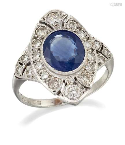 A SAPPHIRE AND DIAMOND CLUSTER RING