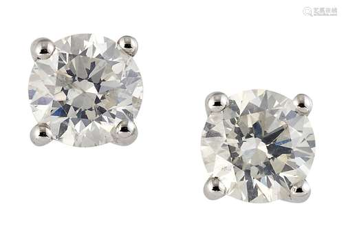 A PAIR OF SOLITAIRE DIAMOND EARRINGS