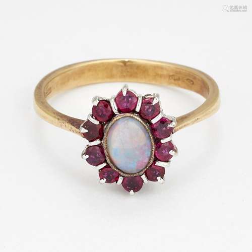 AN 18 CARAT GOLD OPAL AND RUBY CLUSTER RING