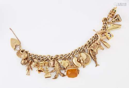 A 9 CARAT GOLD CHARM BRACELET