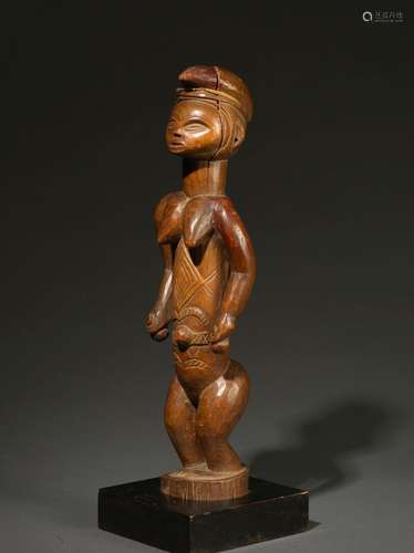 ﻿Statuette Punu<br />
Gabon<br />
Bois. H. 38 cm<br />
Intér...