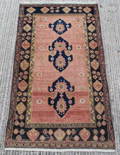 Property of a lady - a Caucasian rug with faded red ground &...