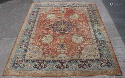 A large antique Tabriz carpet, 194 by 154ins. (492 by 391cms...