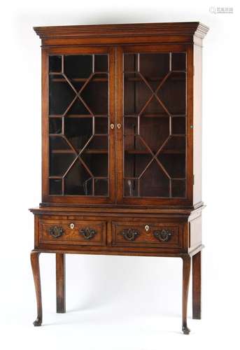 Property of a lady - a George III oak glazed two-door bookca...