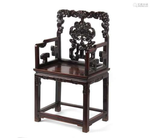 A late 19th century Chinese carved hongmu armchair, with fad...