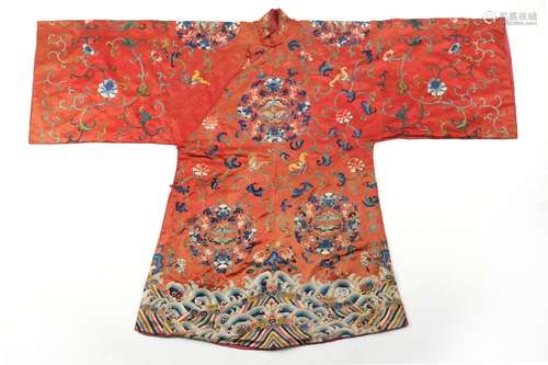 A Chinese embroidered silk long robe with brick red ground, ...