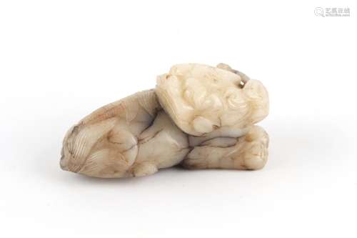 A 17th century Chinese carved mutton fat jade model of a rec...