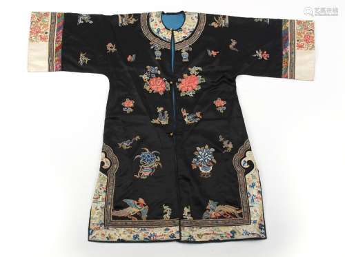 A Chinese embroidered silk robe, late 19th / early 20th cent...