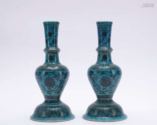 A pair of blue glazed 'floral' candlestick