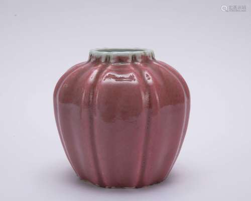 A red-glazed jar