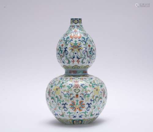 A famille-rose 'floral' gourd-shaped vase