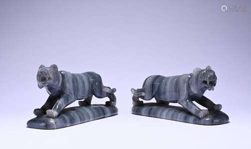 A pair of jade monochrome tiger ornaments