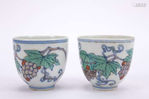 A pair of Dou cai 'grape' cup