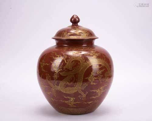 A red-ground glazed 'dragon' painting in gold