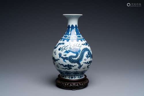A Chinese blue and white 'yuhuchunping' 'dragon' vase on woo...