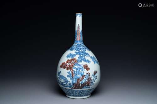 A Chinese blue, white and copper-red bottle vase with a deer...