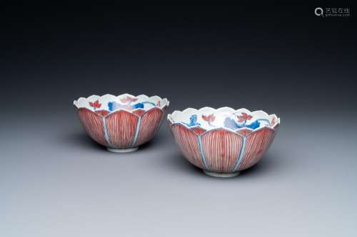 A pair of Chinese blue, white and copper-red 'lotus' bowls, ...
