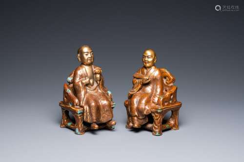 A pair of Chinese partly gilded seated figures, Zeng Long Sh...