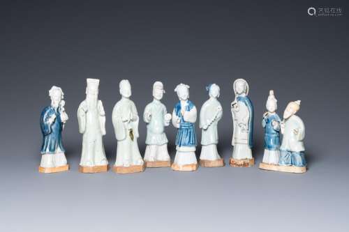 Eight Chinese blue, white and celadon-glazed figures, Qianlo...