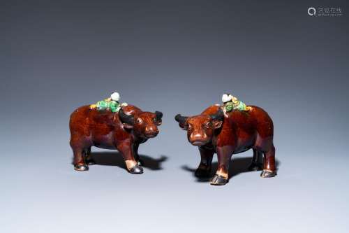 A pair of Chinese verte biscuit groups of boys riding buffal...